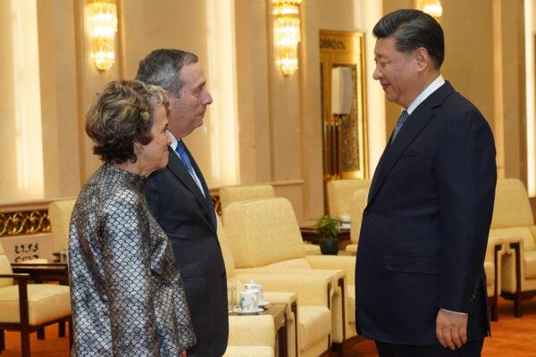Chinese leader Xi Jinping talks to Harvard University President Lawrence Bacow and his wife Adele Fleet Bacow at The Great Hall Of The People in Beijing, China on March 20, 2019. (Andrea Verdelli/Pool/Getty Images)
