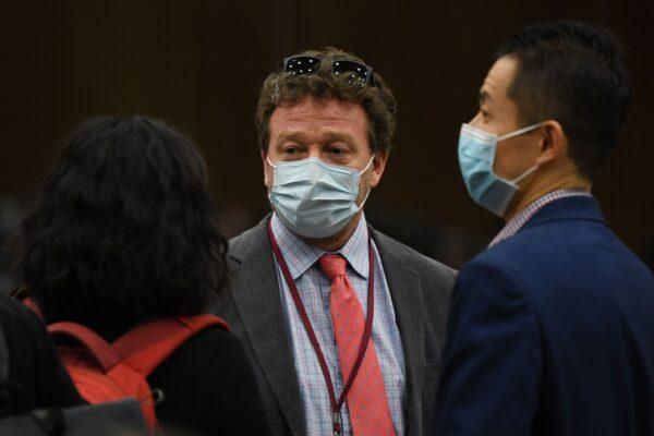 New York Times Beijing bureau chief Steven Lee Myers (C) speaks with other journalists after the daily Foreign Ministry briefing in Beijing on March 18, 2020, when Chinese authorities announced it would expel American journalists from three major U.S. newspapers. (Greg Baker/AFP via Getty Images)