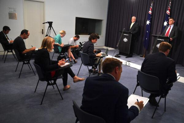 Prime Minister Scott Morrison and Chief Medical Officer Brendan Murphy during a press conference in the Blue Room at Parliament House on March 24, 2020 in Canberra, Australia. (Sam Mooy/Getty Images)