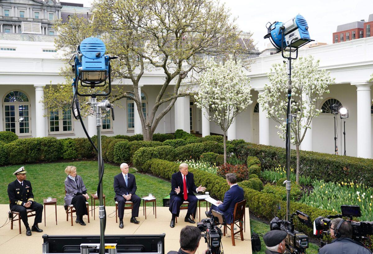 (L-R) Surgeon General Jerome Adams, Response Coordinator for White House Coronavirus Task Force Deborah Birx, Vice President Mike Pence, and President Donald Trump take part in a Fox News virtual town hall meeting with anchor Bill Hemmer, from the Rose Garden of the White House in Washington on March 24, 2020. (Mandel Ngan/AFP via Getty Images)