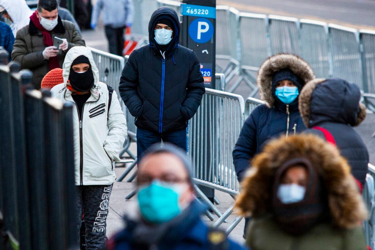 People line up to get a test at Elmhurst Hospital due to the CCP virus outbreak in Queens, New York, on March 24, 2020. (Eduardo Munoz Alvarez/Getty Images)