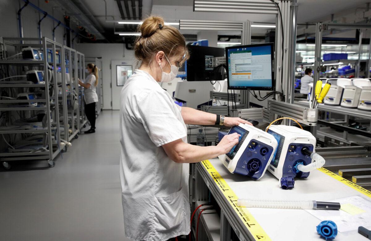Employees of Hamilton Medical AG test ventilators at a plant in Domat/Ems, Switzerland, on March 18, 2020. (Reuters/Arnd Wiegmann/File Photo)