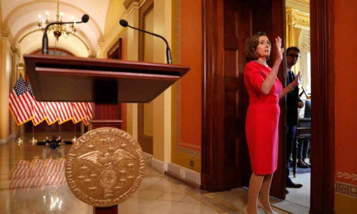 Man in Viral Photo Carrying Pelosi’s Lectern Is Arrested