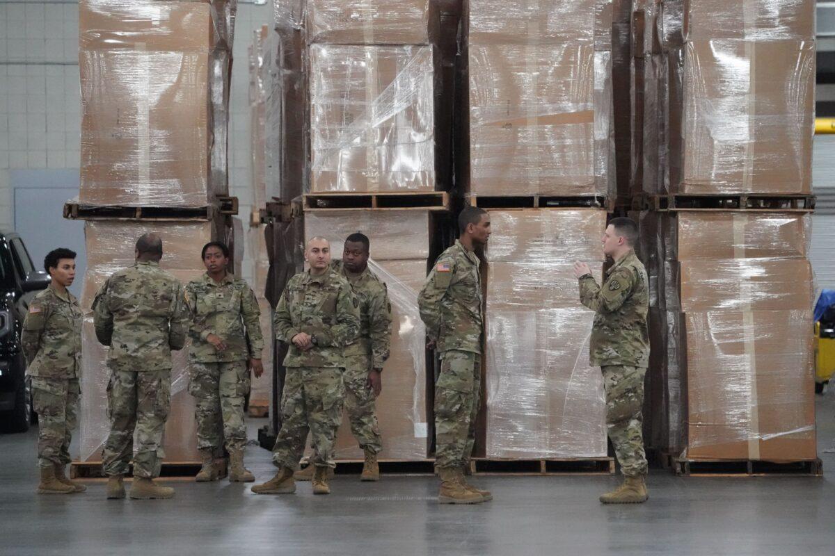 U.S. Army National Guard members walk through the Jacob Javits Center on Manhattan’s West Side in New York City on March 23, 2020. (Bryan R. Smith/AFP/Getty Images)