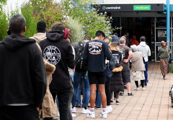 People are seen lining up at Centrelink in Flemington on March 23, 2020 in Melbourne, Australia after COVID-19 pandemic lockdowns started. (Quinn Rooney/Getty Images)