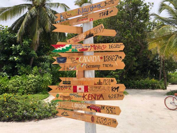 Signage showing various distances from the Maldives. (Tim Johnson)