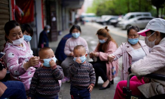 Lockdown Lifted, but Exodus From Chinese City Hindered by New Coronavirus Test Rule