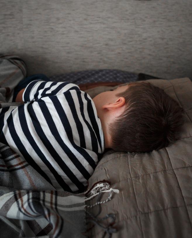 Illustration - Shutterstock | <a href="https://www.shutterstock.com/image-photo/sick-little-boy-sleeping-on-his-1675588375">Irina Polonina</a>