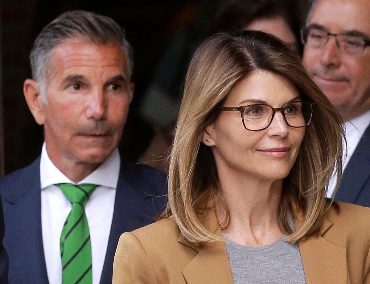 Actress Lori Loughlin, front, and her husband, clothing designer Mossimo Giannulli (L) depart federal court in Boston, on April 3, 2019. (Steven Senne/AP Photo)
