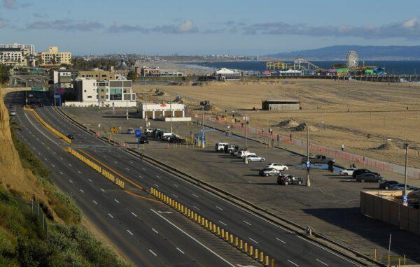 Light traffic and a mostly empty parking lot is seen along Pacific Coast Highway, in Santa Monica, Calif., on March 23, 2020. (Mark J. Terrill/AP Photo)