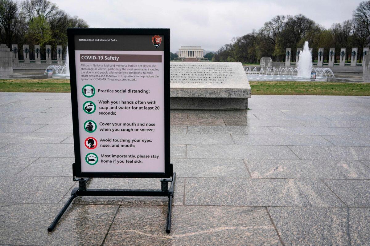 A sign of proper COVID-19 safety precautions near the Lincoln Memorial on the National Mall in Washington on March 25, 2020. (Alex Edelman/AFP via Getty Images)