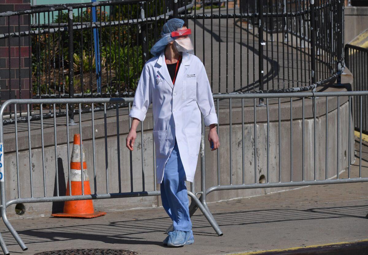A physician is seen outside at Elmhurst Hospital Center in the Queens borough of New York City on March 26, 2020. (Angela Weiss/AFP via Getty Images)