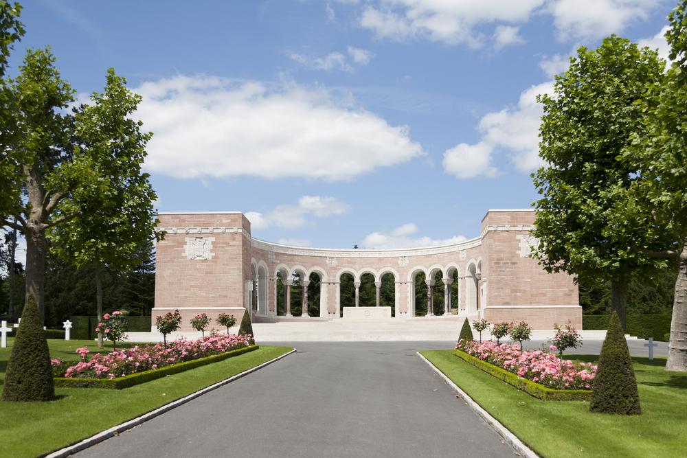 The memorial at the Oise-Aisne WW1 American Cemetery and Memorial in France. The curving colonnade is built of rose-colored sandstone. (Mattpix/Shutterstock)