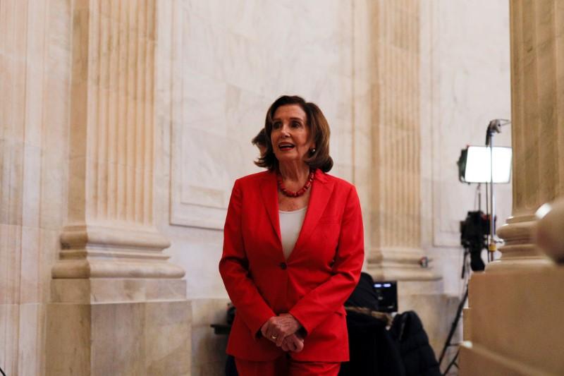 House Speaker Nancy Pelosi (D-Calif.) speaks to news reporters ahead of a vote on the CCP virus relief bill on Capitol Hill in Washington on March 25, 2020. (Tom Brenner/Reuters)