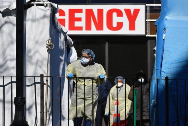 Medical workers outside at Elmhurst Hospital Center in the Queens borough of New York City on March 26, 2020. (Angela Weiss/AFP via Getty Images)