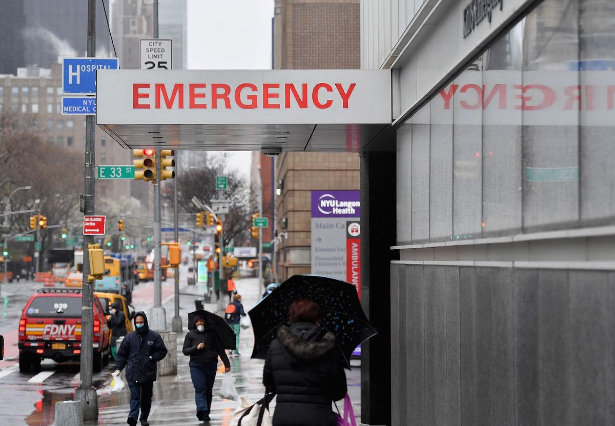 A sign is seen at the NYU Langone Health Center hospital emergency room entrance in New York City on March 23, 2020. (Angela Weiss/AFP via Getty Images)