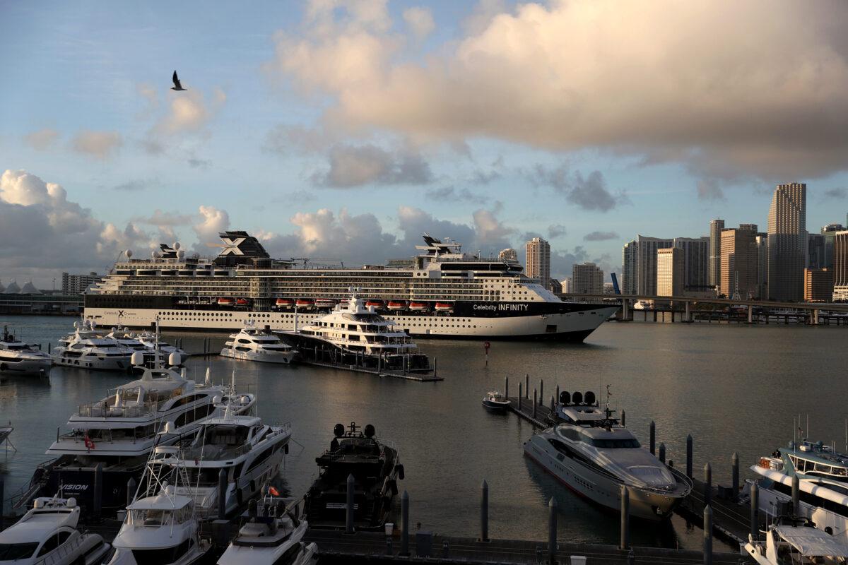 In this drone image, the Celebrity Infinity Cruise ship, a wholly-owned subsidiary of Royal Caribbean Cruises Ltd, returns to Port Miami from a cruise in the Caribbean as the world deals with the coronavirus outbreak on March 14, 2020. (Joe Raedle/Getty Images)