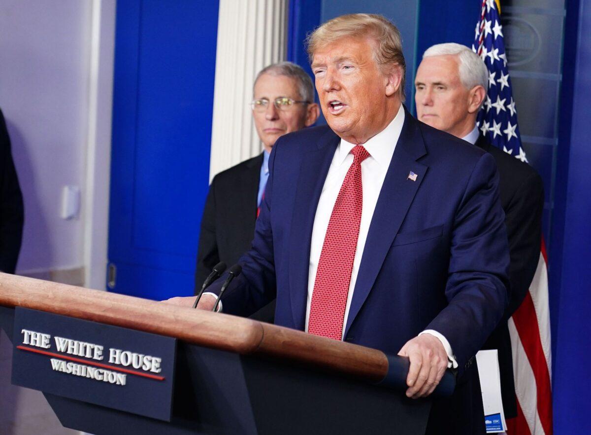 President Donald Trump speaks during the daily briefing on the novel coronavirus as Director of the National Institute of Allergy and Infectious Diseases Anthony Fauci, left, and Vice President Mike Pence look on at the White House in Washington, DC on March 25, 2020. (Mandel Ngan/AFP via Getty Images)