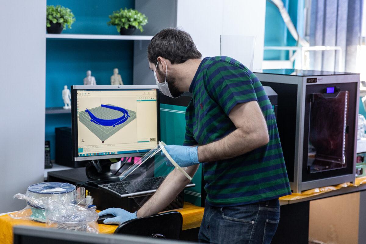 An academic at the Federal University of Rio Grande do Sul makes protective masks using 3D printing technology in Porto Alegre, Brazil, on March 26, 2020. (Lucas Uebel/Getty Images)