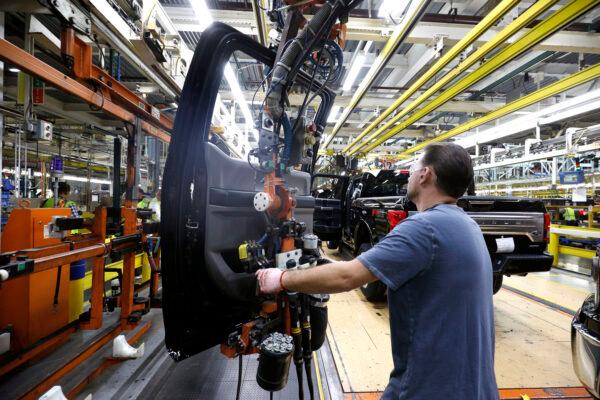 A Ford Motor Company workers works on a Ford F150 truck on the assembly line at the Ford Dearborn Truck Plant in Dearborn, Mich., on Sept. 27, 2018. (Bill Pugliano/Getty Images)