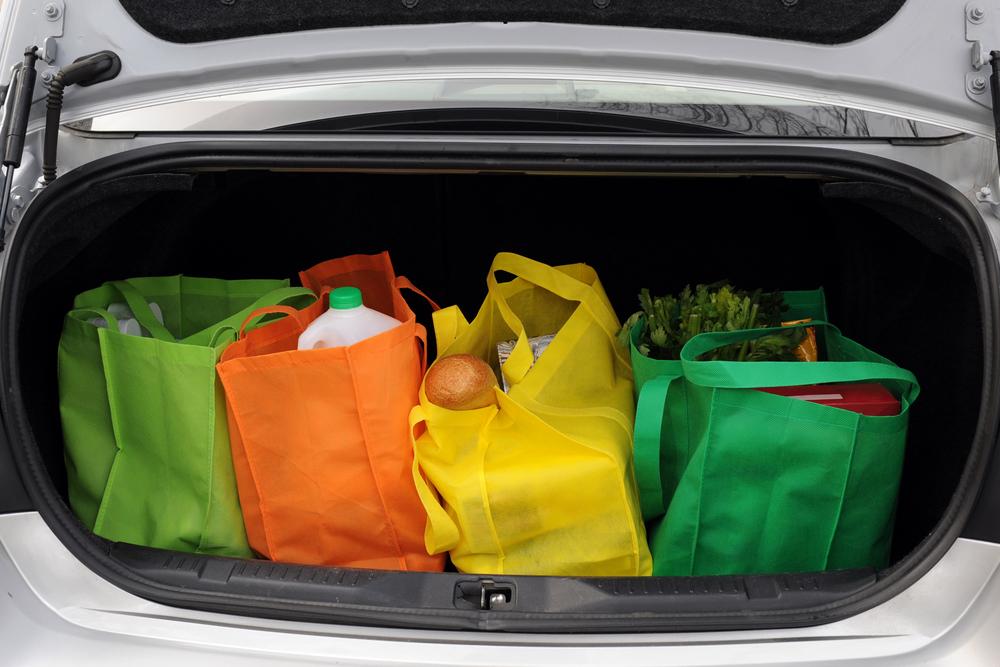 Illustration - Shutterstock | <a href="https://www.shutterstock.com/image-photo/four-colorful-ecofriendly-shopping-bags-filled-27178372">glenda</a>