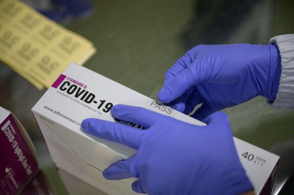COVID-19 testing kits are packaged on a production line at the SD Biosensor bio-diagnostic company near Cheongju, South Korea, on March 27, 2020. (Ed Jones/AFP via Getty Images)