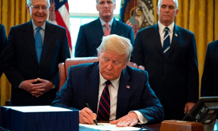 Trump Signs Largest Stimulus Bill in Modern US History