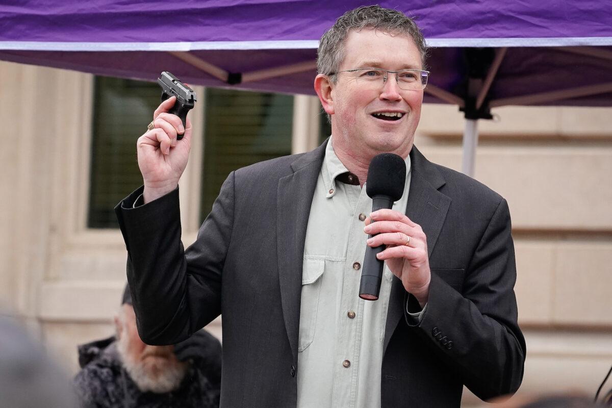 Rep Thomas Massie (R-KY) draws a Ruger LCP handgun from his pocket during a rally in support of the Second Amendment, in Frankfort, Kentucky, on Jan. 31, 2020. (Bryan Woolston/Getty Images)