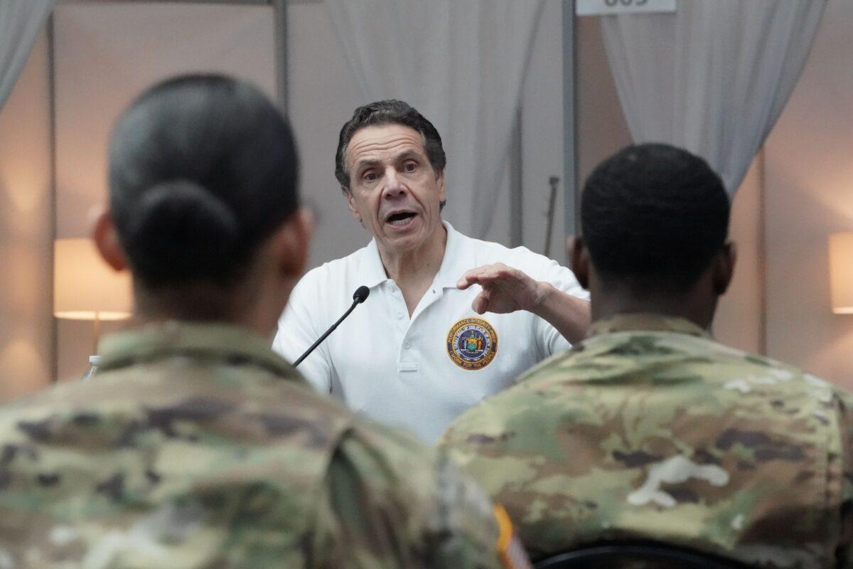 National Guard troops listen as New York Governor Andrew Cuomo speaks to the press at the Jacob K. Javits Convention Center in New York, on March 27, 2020. (Bryan R. Smith/AFP via Getty Images)