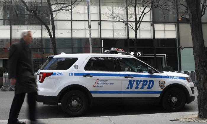 2 New York Residents Charged With Torching NYPD Van