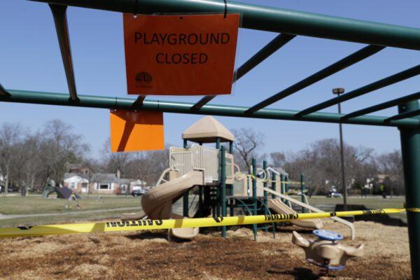 A sign announces that the playground is closed at Cartwright Park in Evanston, Ill., on March 25, 2020. (Nam Y. Huh/AP Photo)