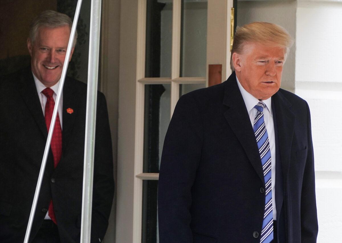 President Donald Trump is followed by White House Chief of Staff Mark Meadows as he departs for a day trip to Norfolk, Virginia, from the White House in Washington, on March 28, 2020. (Reuters/Joshua Roberts)