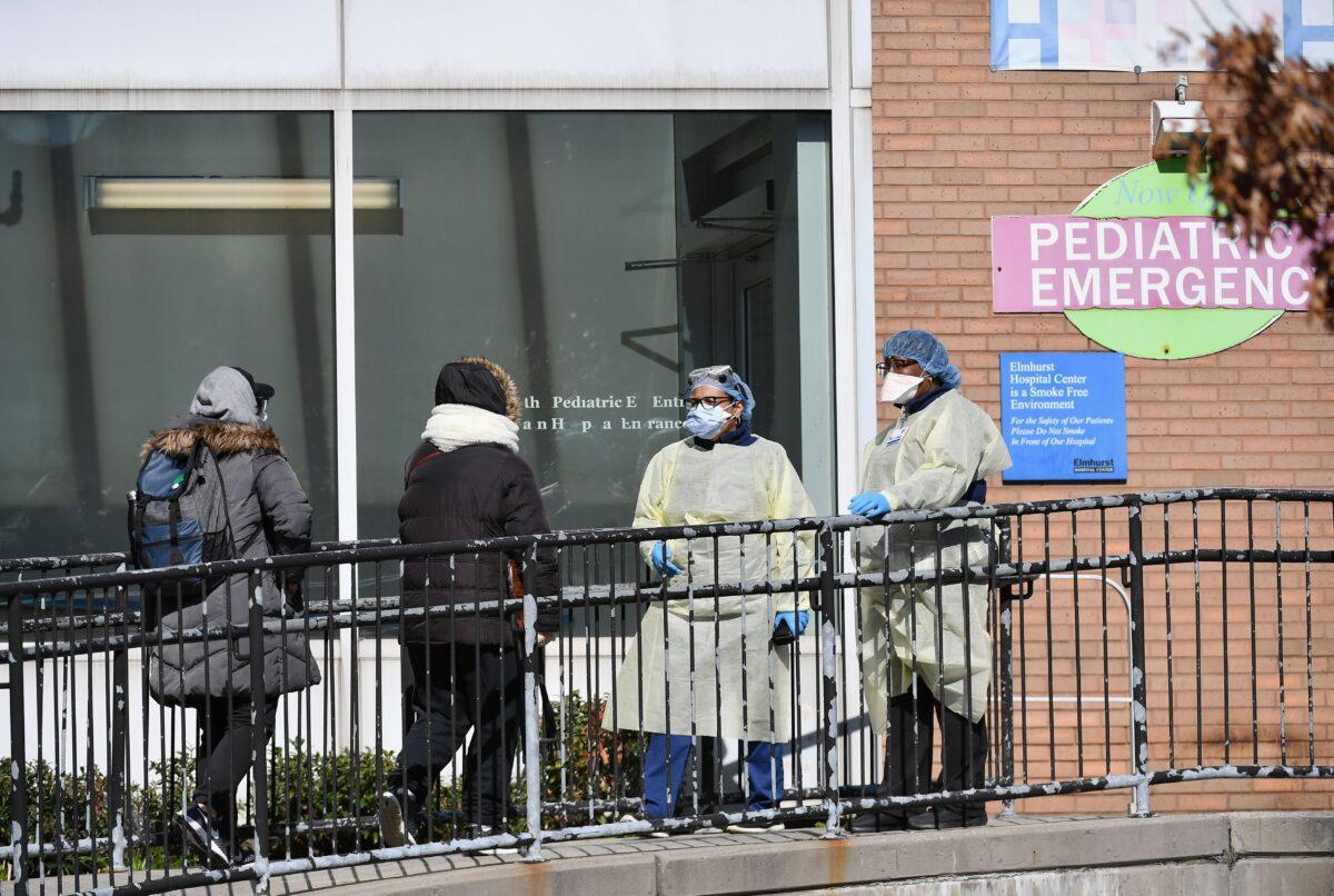 Medical staff check people in to get tested for the CCP virus at Elmhurst Hospital Center in the Queens borough of New York City on March 26, 2020. (Angela Weiss/AFP via Getty Images)