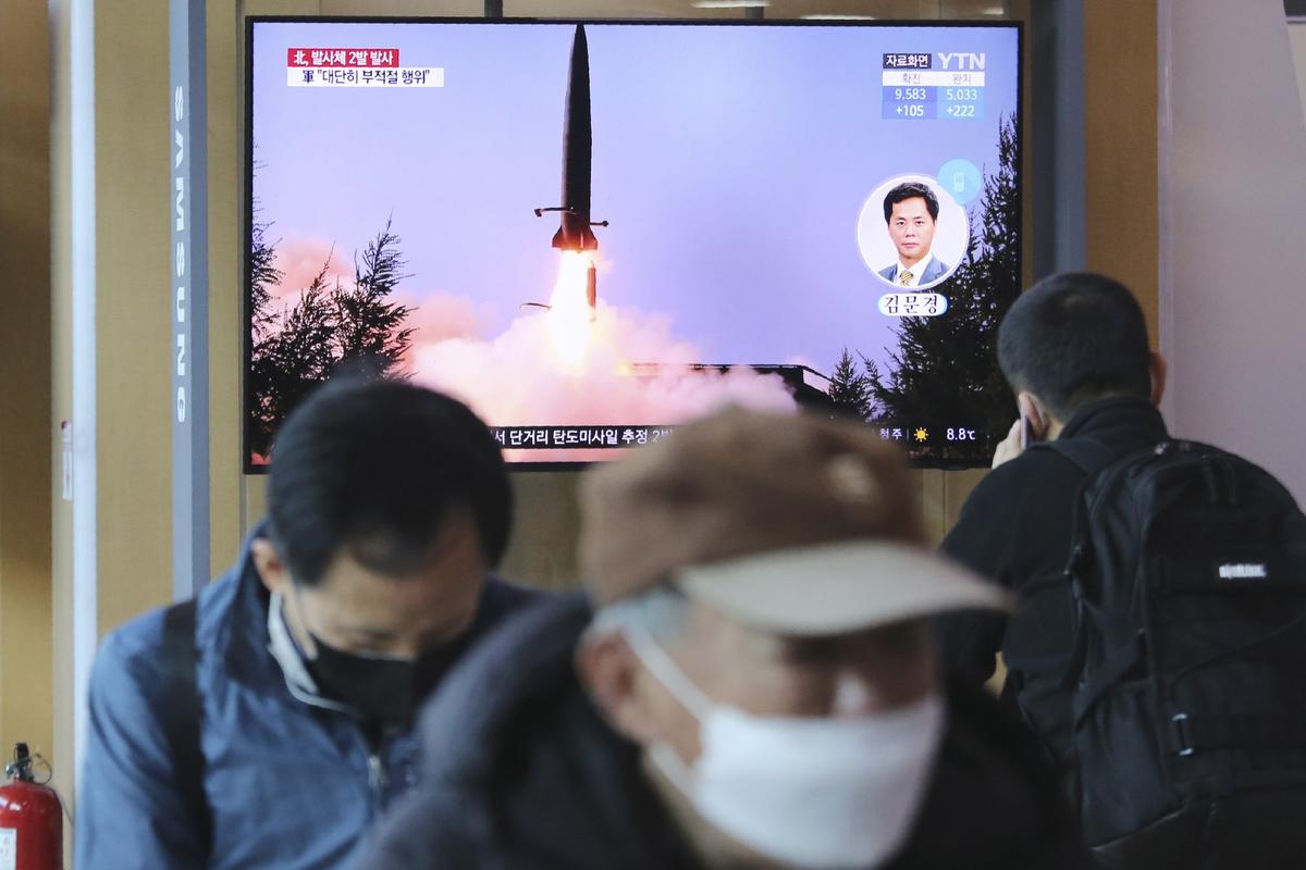 A TV screen shows a file image of North Korea's missile launch during a news program at the Seoul Railway Station in Seoul, South Korea, on March 29, 2020. (Ahn Young-joon/AP Photo)