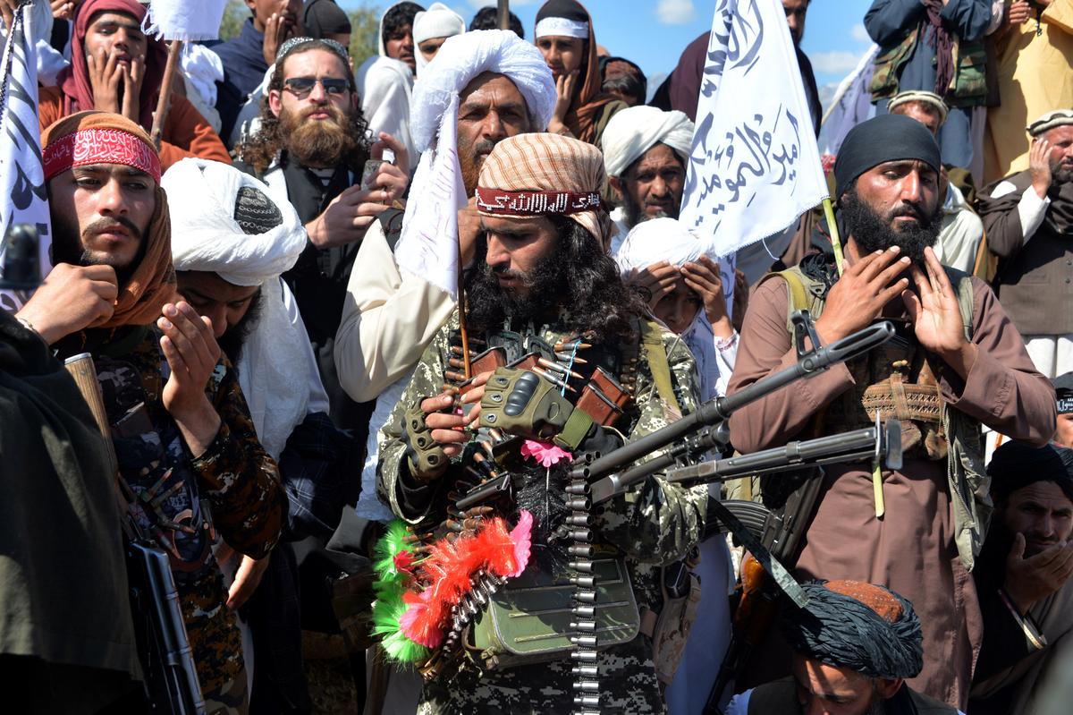 Afghan Taliban militants and villagers attend a gathering as they celebrate the peace deal and their victory in the Afghan conflict with the United States in Afghanistan, in Alingar District of Laghman Province on March 2, 2020. (Noorullah Shirzada /AFP via Getty Images)