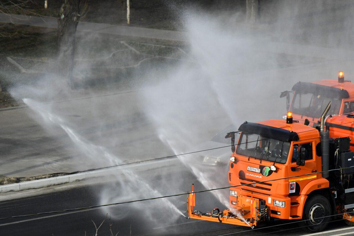 A municipal vehicle disinfects a street on the outskirts of Moscow, as the city attempts to curb the spread of the COVID-19, the disease caused by the novel coronavirus, Moscow, Russiam on March 28, 2020. (Kirill Kudryavtsev / AFP) via Getty Images)