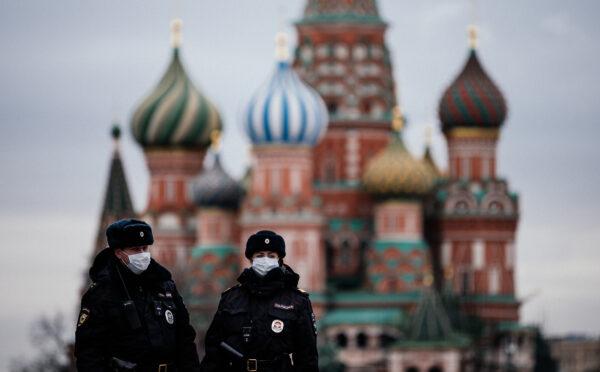 Russian police officers patrol in front of Saint Basil's Cathedral in Moscow on March 30, 2020. (Dimitar Dilkoff /AFP via Getty Images)