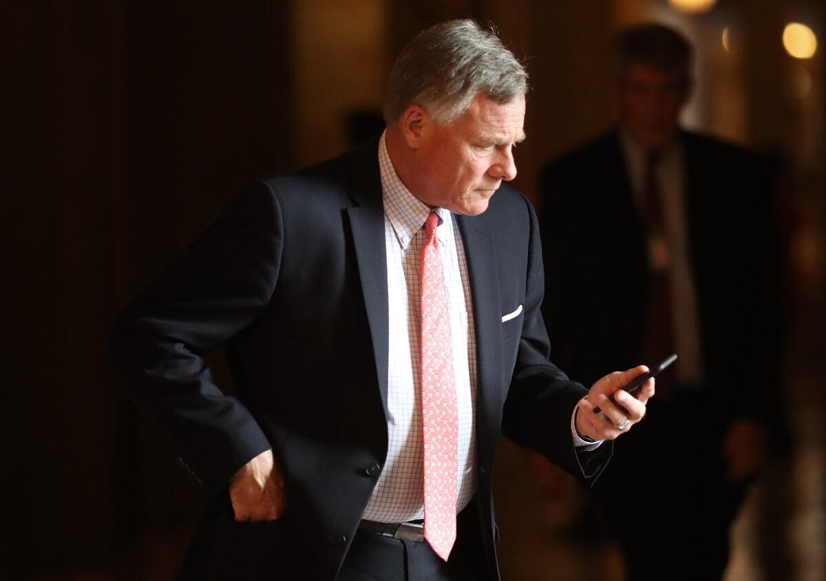 Sen Richard Burr (R-N.C.) makes a phone call during the weekly Republican policy luncheon in Washington on September 25, 2018. (Win McNamee/Getty Images)