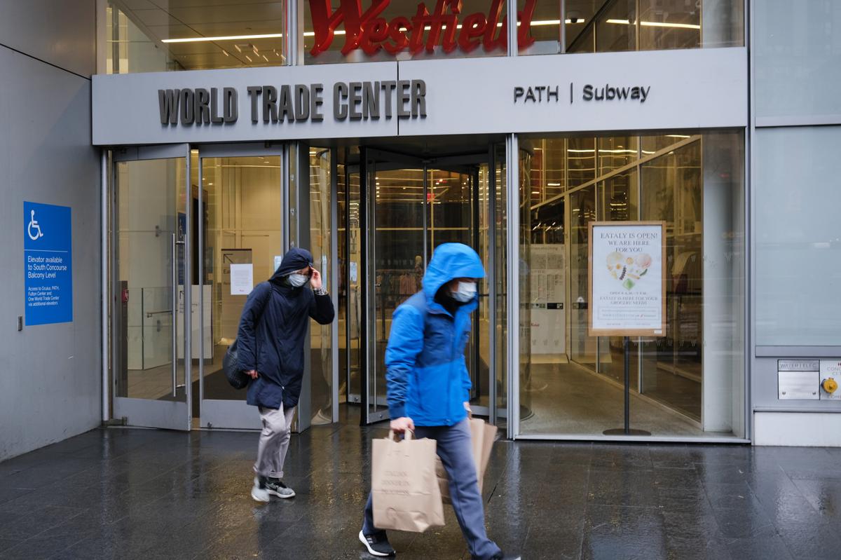 A couple wearing face masks exits a grocery store in lower Manhattan in New York City on March 29, 2020. (Spencer Platt/Getty Images)