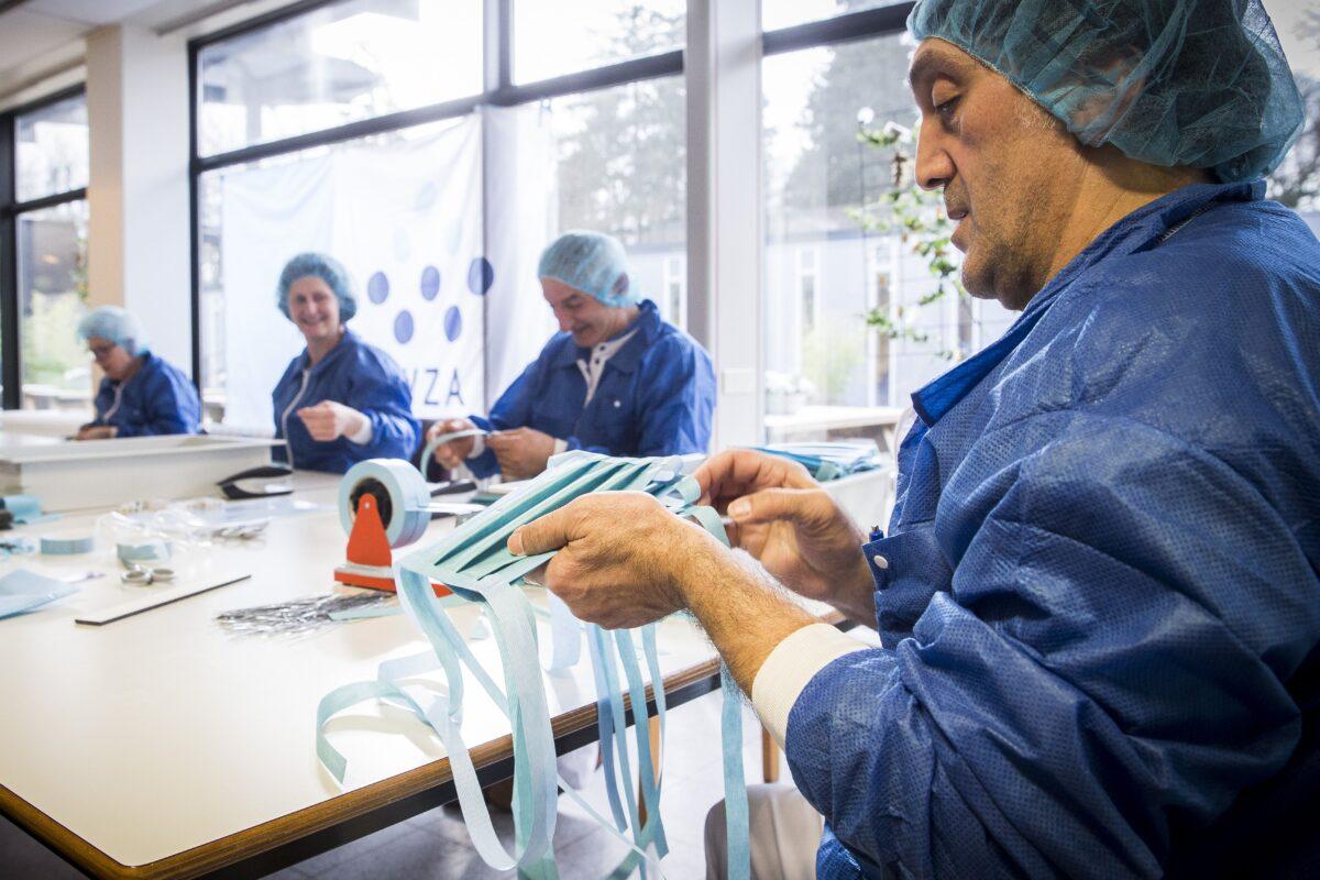 Employees make protective masks at the Wilhelmina Hospital in Assen, Netherland, on March 20, 2020. (Vincent Jannink/ANP/AFP via Getty Images)