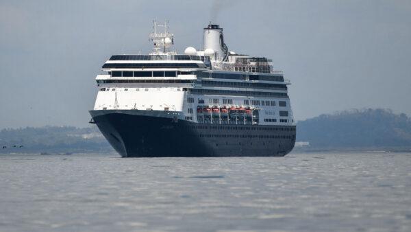 The Zaandam cruise ship enters the Panama City Bay to be assisted by the Rotterdam cruise ship with supplies, personnel, and COVID-19 testing devices, 8 miles from Panama City, on March 27, 2020. (Luis Acosta/AFP via Getty Images)