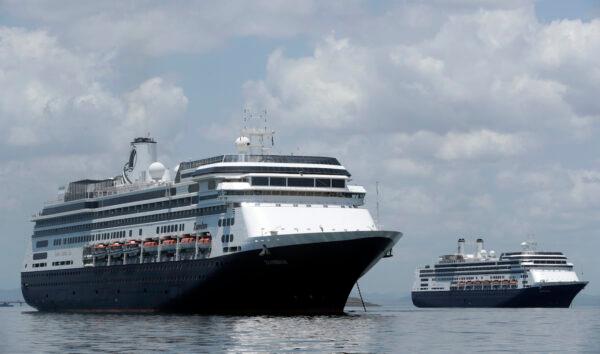 The Zaandam cruise ship (L) carrying some guests with flu-like symptoms, is anchored shortly after it arrived to the bay of Panama City, on March 27, 2020, amid the worldwide spread of the CCP virus. (Arnulfo Franco/AP)