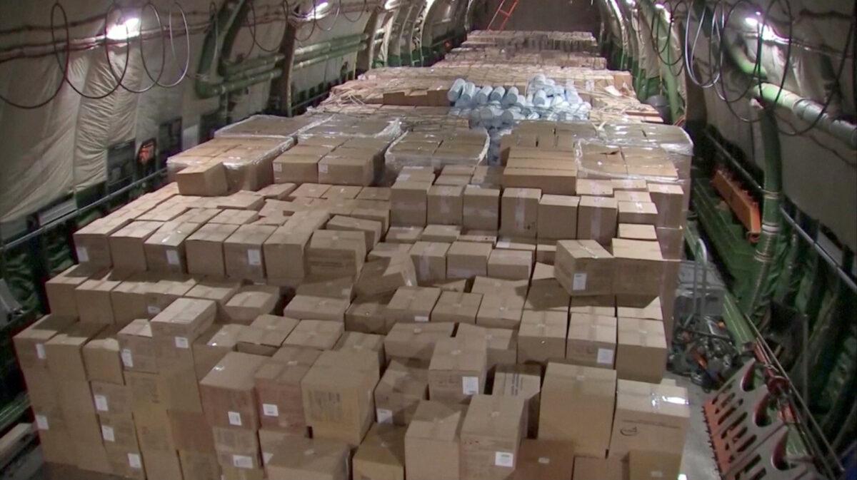 Boxes with medical equipment and masks to help fight the CCP virus (COVID-19) are seen on board a Russian military transport plane ahead of its departure to the United States of America, at an airdrome outside Moscow, Russia on April 1, 2020, in this screen grab taken from video. (Russian Defense Ministry/Handout via Reuters)