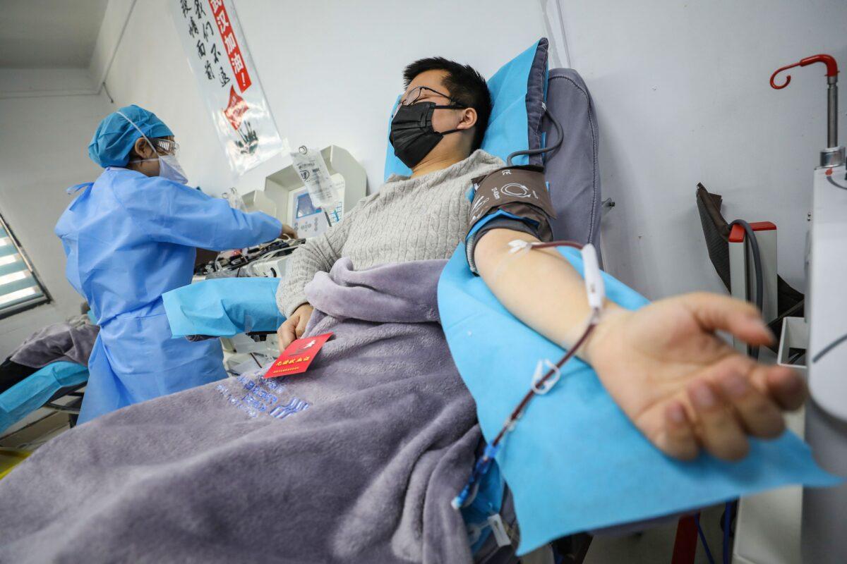 A doctor who recovered from the CCP virus donates plasma in Wuhan, China, in a file photograph. (STR/AFP via Getty Images)