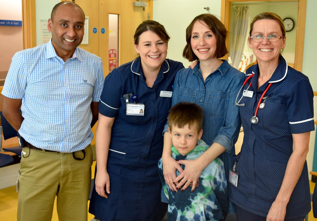 The mother-son duo with their treatment team at the hospital. (Courtesy of <a href="https://www.worcsacute.nhs.uk/">Worcestershire Acute Hospitals NHS Trust</a>)