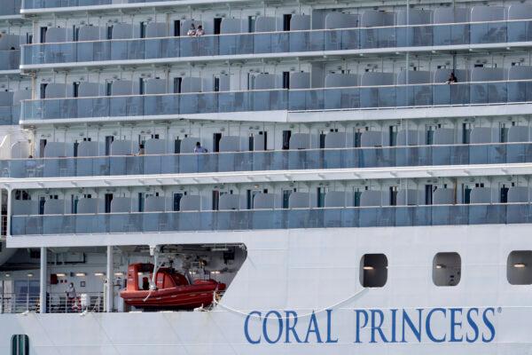 People look out from the Coral Princess cruise ship as it is docked at PortMiami during the CCP virus outbreak, in Miami, on April 4, 2020. (Lynne Sladky/AP)