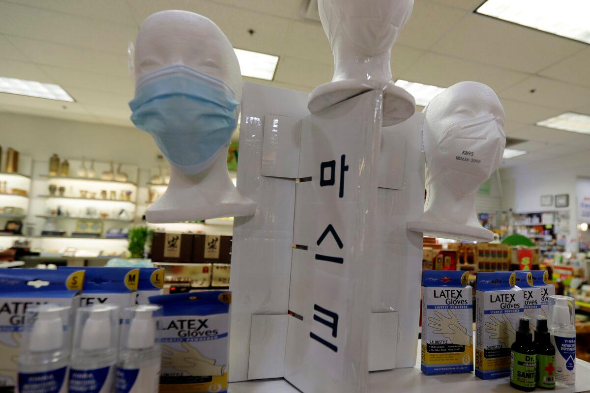Masks and hand sanitizers are displayed at a Hyundai Happy World supplements store during the CCP virus outbreak in Niles, Ill., on April 3, 2020. (Nam Y. Huh/AP Photo)