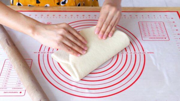 Folding the dough into thirds. (CiCi Li)