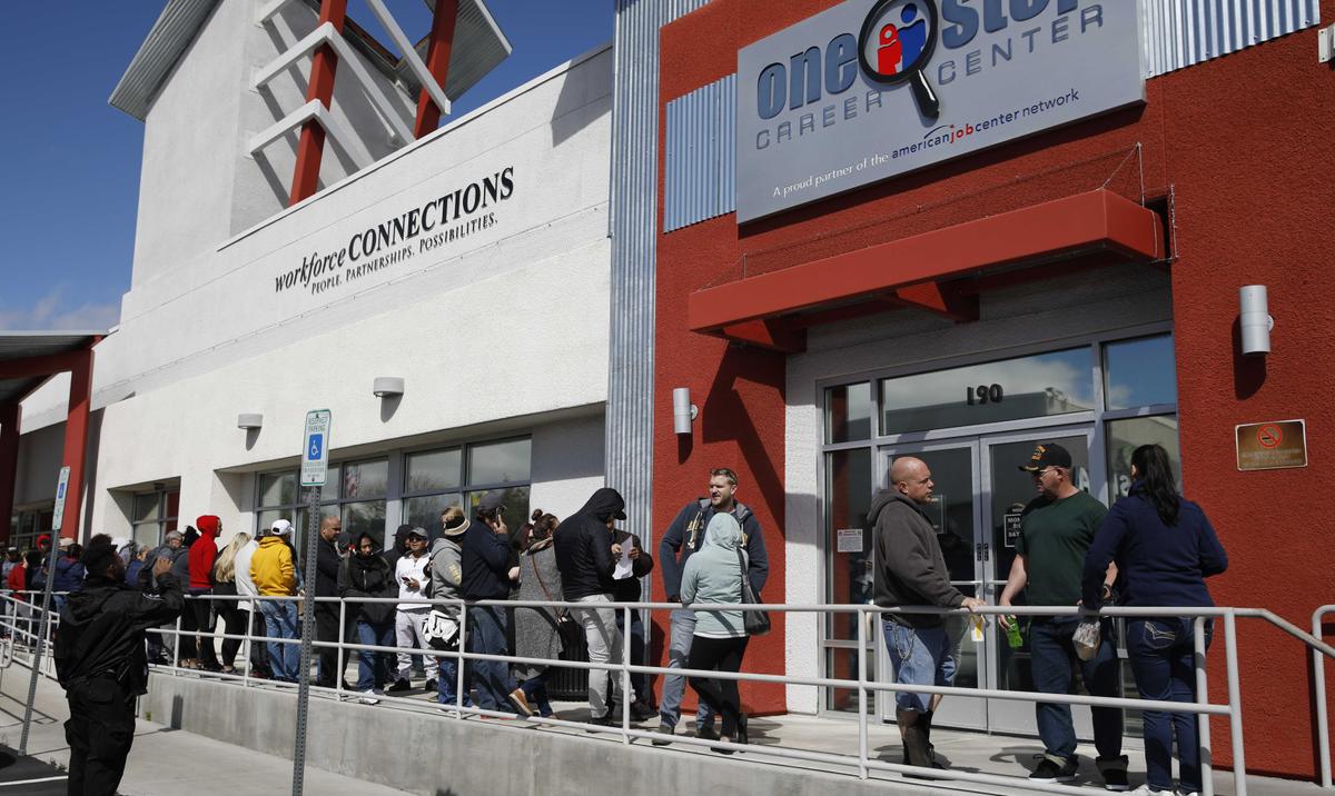People wait in line for help with unemployment benefits at the One-Stop Career Center in Las Vegas, Nev., on March 17, 2020. (John Locher/AP Photo)
