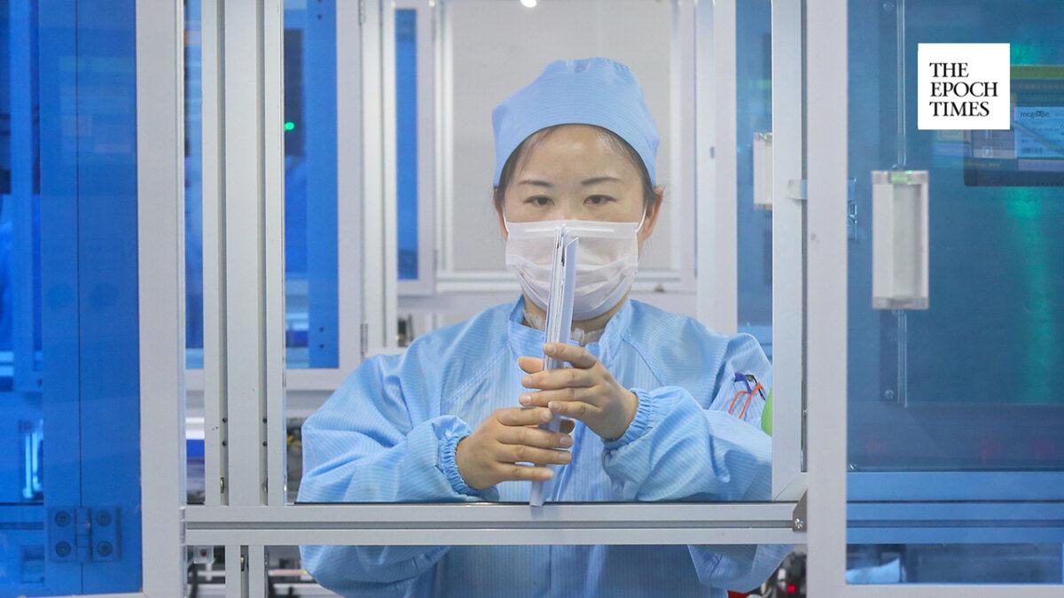 A worker produces test kits for COVID-19 in Nantong in China's eastern Jiangsu Province on March 9, 2020. (STR/AFP via Getty Images)